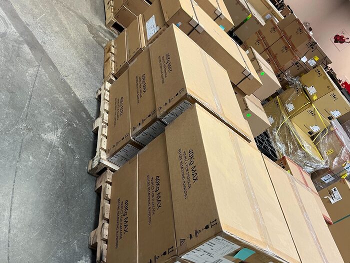 Pallets of boxed goods stacked and banded ready to be taken away